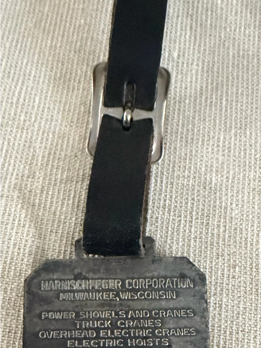 Black Leather Luggage Tag with Metal Excavator Emblem